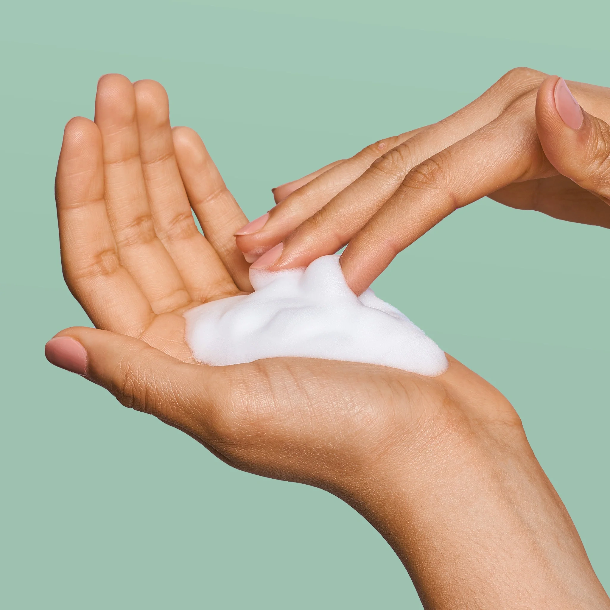 Rael Gentle Foaming Feminine Wash in hands